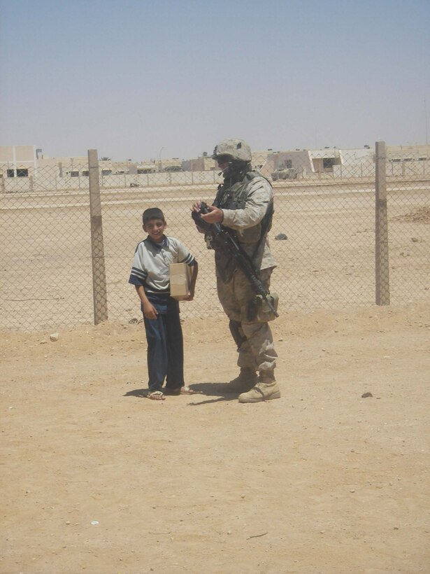 Cpl. Morgan J. Hendrickson, driver/civil affairs assistant, 5th Civil Affairs Group (CAG), 2d Light Armored Reconnaissance Battalion, Regimental Combat Team-2,  and the other members of CAG work on supplying some of the towns in western Iraq with water, building hospitals, improving schools and helping to rebuild other vital parts of the cities. (Photo by Cpl. Freddy Medina)