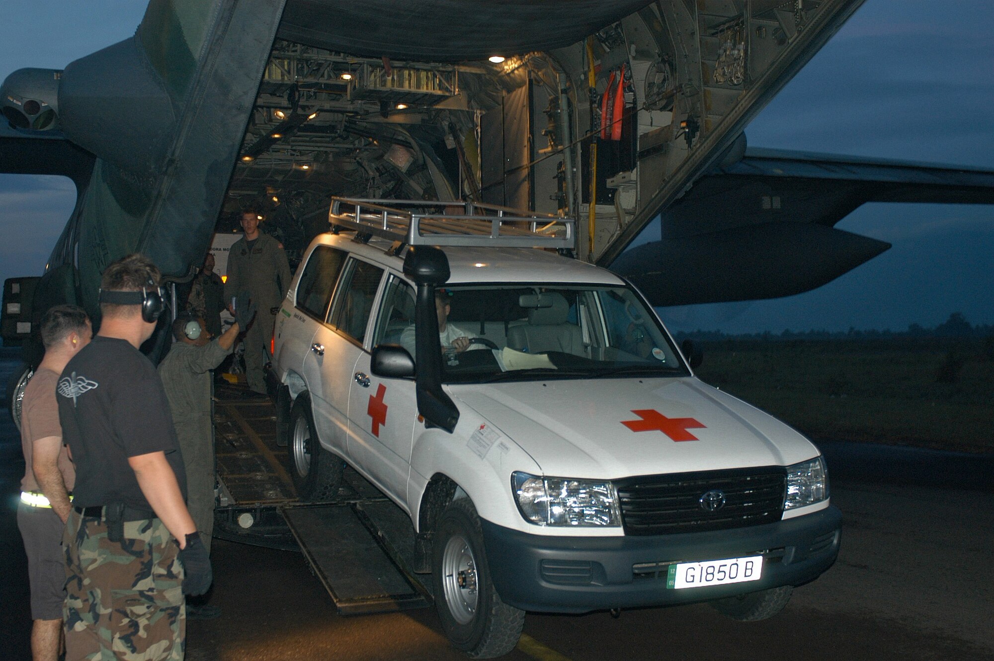 BANDA ACEH, Indonesia -- A Spanish Red Cross support vehicle is driven off an MC-130H Combat Talon II here.  Hundreds of doctors, nurses, nongovernmental disaster aid specialists and related equipment have been flown north from Langkawi, Malaysia.  Washed-out roads make overland travel nearly impossible.  (U.S. Air Force photo by Master Sgt. Michael Farris)
