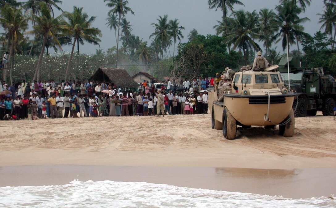 An amphibious vehicle gets ready to bring Marines and Sailors aboard the LCU at the end of the day. The 15th Marine Expeditionary Unit (Special Operations Capable) provides desperately needed humanitarian aid to cities and villages along Sri Lanka's southern coastline.