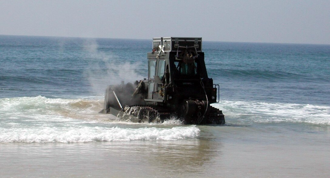 A tactical bulldozer is driven into the ocean to be cooled off after clearing debris along the coastline here.  The 15th Marine Expeditionary Unit (Special Operations Capable) provided desperately needed humanitarian aid to cities and villages along Sri Lanka's southern coastline.