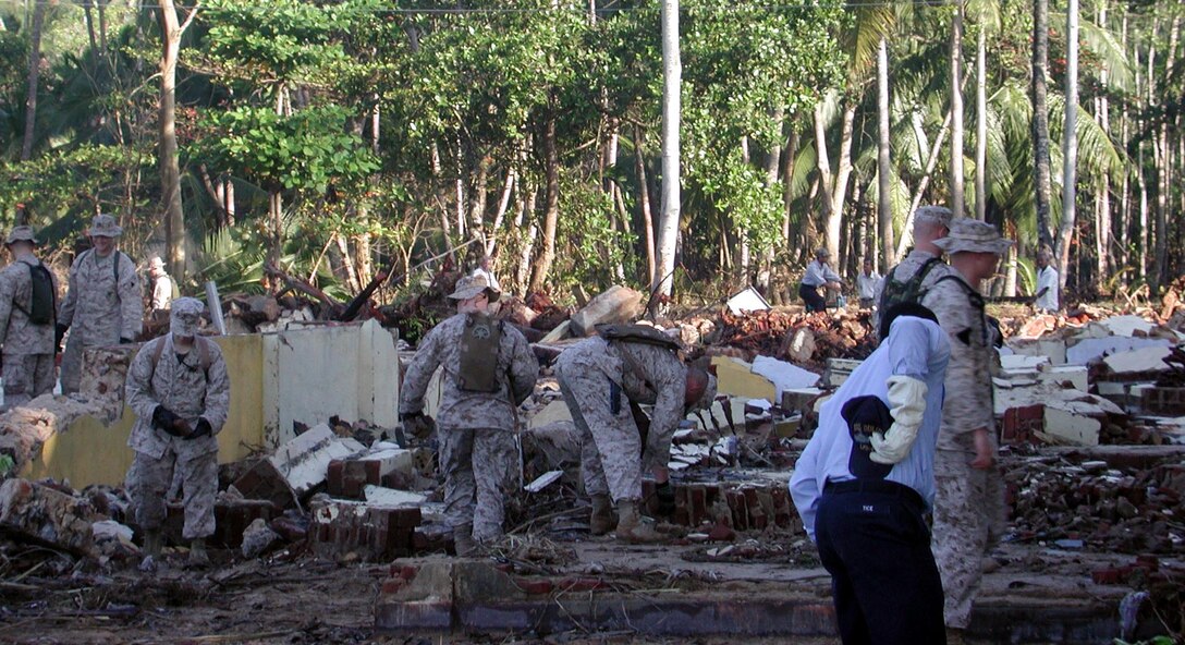 Marines and Sailors work to remove rubble from where a school once stood. Shortly after, heavy equipment cleared the whole area to allow for a new building to be erected. The 15th Marine Expeditionary Unit (Special Operations Capable) provided desperately needed humanitarian aid to cities and villages along Sri Lanka's southern coastline.