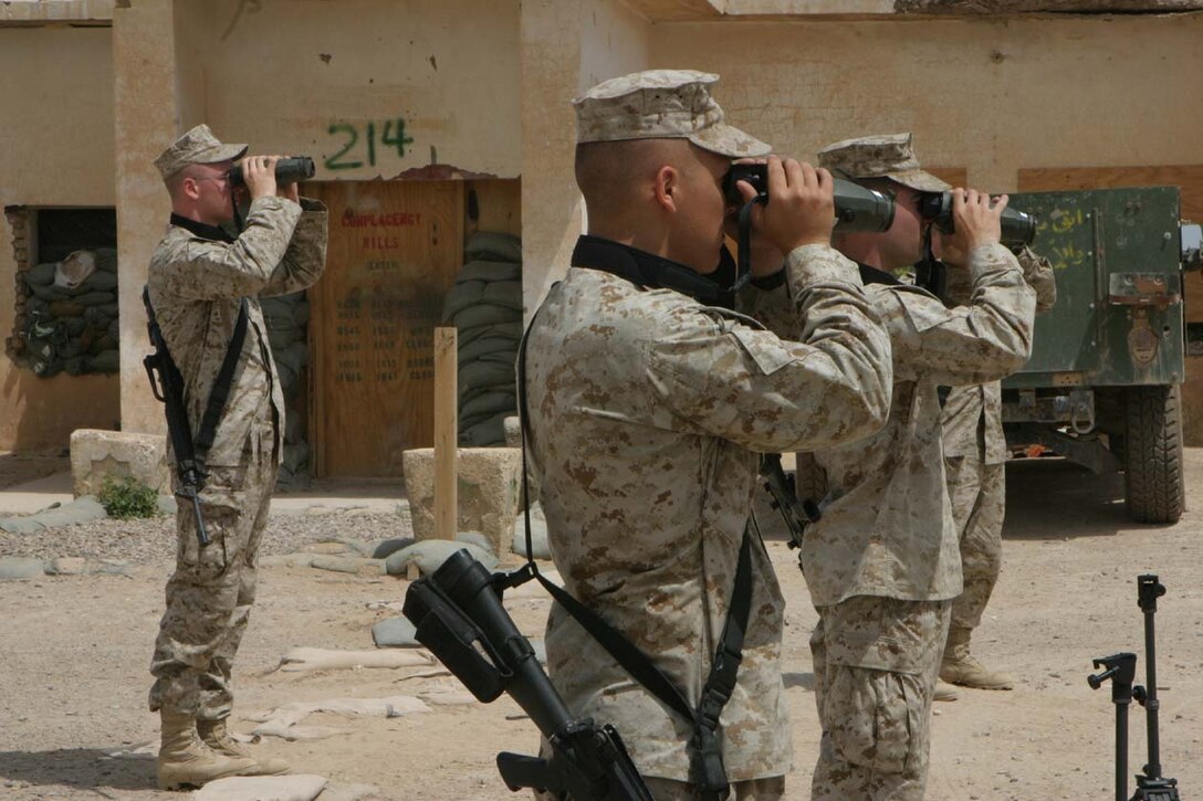 CAMP FALLUJAH, IRAQ -- Marines from all companies in 3rd Battalion, 8th Marine Regiment were taught how to use the new optics, Common Laser Range Finder Vector 21 Bravo.  Moving out of the classroom, the Marines took time to go through practical application and asked questions on how to operate and set up the system.  The Marines are the few who will further train their comrades to be able to use the new optic equipment. Official U.S. Marine Corps photo by Lance Cpl. Athanasios L. Genos