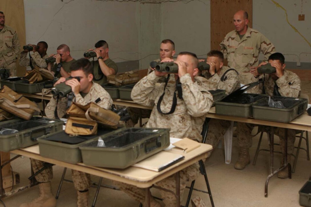 CAMP FALLUJAH, IRAQ -- Marines from all companies in 3rd Battalion, 8th Marine Regiment were taught how to use the new optics, Common Laser Range Finder Vector 21 Bravo.  In the classroom, the Marines were taught the basics on how to properly operate and use preventative maintenance on the system.  The Marines are the few who will further train their comrades to be able to use the new optic equipment. Official U.S. Marine Corps photo by Lance Cpl. Athanasios L. Genos