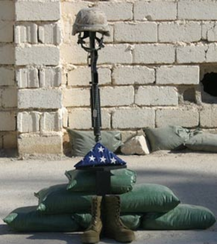 A memorial stands for Cpl. Joshua D. Snyder during the memorial service held to honor him Dec. 11. Snyder, a 20-year-old Hampstead, Md. Native, was killed in action Nov. 30, 2005 by anti-coalition forces while deployed with Company E, 2nd Battalion, 6th Marines.