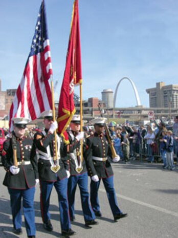 The RS St. Louis color guard marches in the St. Louis Mardi Gras Parade.