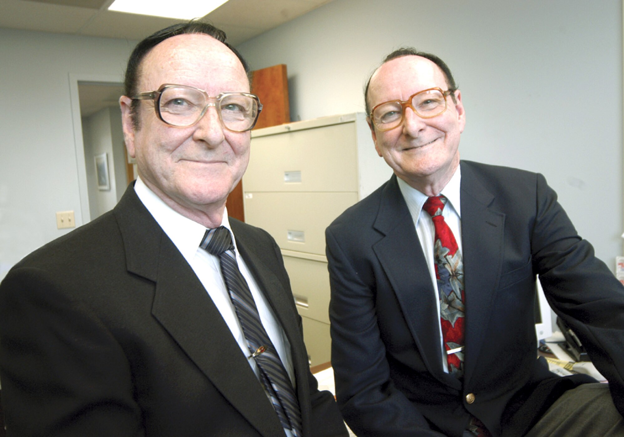 ROBINS AIR FORCE BASE, Ga. -- Bobby (left) and Billy Edwards received pins for 50 years of service recently.  The 69-year-old identical twins joined federal service at Robins shortly after graduating from high school.  (U.S. Air Force photo by Sue Sapp)