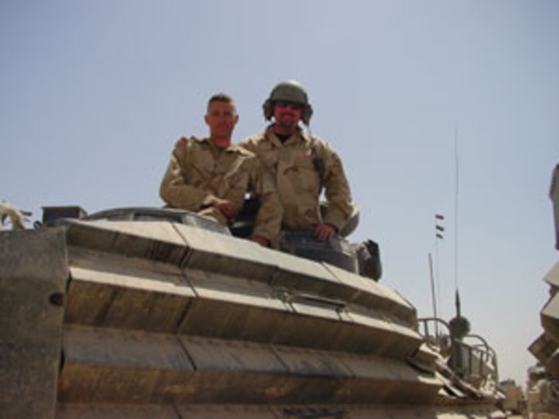 During their flight, Iraqi Commands pose for a photo with Cpl. David Finn, a loadmaster with Marine Aerial Refueler and Transport Squadron 252, while inside the KC-130J Hercules. ?I think it was great meeting the Iraqis,? said Finn, a native of Cleveland. ?They were respectful of everything I needed them to do and very polite. Overall, they are a well disciplined group.?