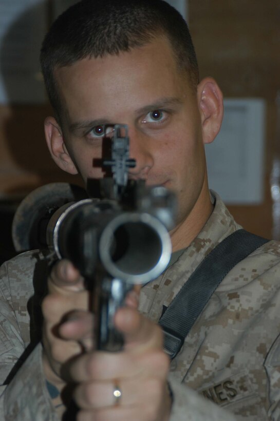 CAMP HURRICANE POINT Ar Ramadi, Iraq (May 12, 2005) -Sergeant Tim R. Cyparski, a section leader with 1st Platoon, Company W, 1st Battalion, 5th Marine Regiment, aims a rocked propelled grenade launcher he his fellow warriors took from insurgents during a mission in the city. The 27-year-old from Erie, Pa., and other Marines with 1st Platoon killed three insurgents while responding to a casualty evacuation request. The Marines discovered a rocket propelled grenade launcher, a PKM machine gun with more than 100 armor-piercing rounds, a Romanian assault rife, three AK-47 assault rifles and more than 300 rounds of ammunition. Photo by Cpl. Tom Sloan