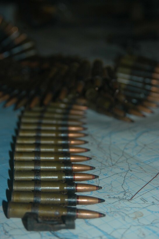 CAMP HURRICANE POINT Ar Ramadi, Iraq (May 12, 2005) - Armor-piercing rounds lie on a table in the command operations center of Company W, 1st Battalion, 5th Marine Regiment. Marines with 1st Platoon, Company W, took a rocket propelled grenade launcher, a PKM machine gun with more than 100 armor-piercing rounds, a Romanian assault rife, three AK-47 assault rifles and more than 300 rounds of ammunition from insurgents during a mission in the city. The Marines engaged insurgents in a firefight and killed three of the enemy combatants. Photo by Cpl. Tom Sloan