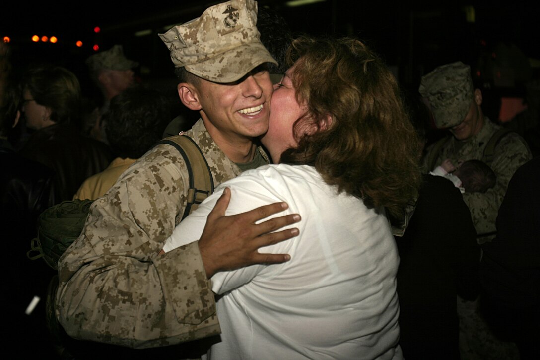 MARINE CORPS BASE CAMP LEJEUNE, N.C. - A Marine with 1st Battalion, 6th Marine Regiment hugs his loved one shortly after arriving here Oct. 12.  The unit returned home after conducting seven months of security and stability operations in and around Fallujah, Iraq.