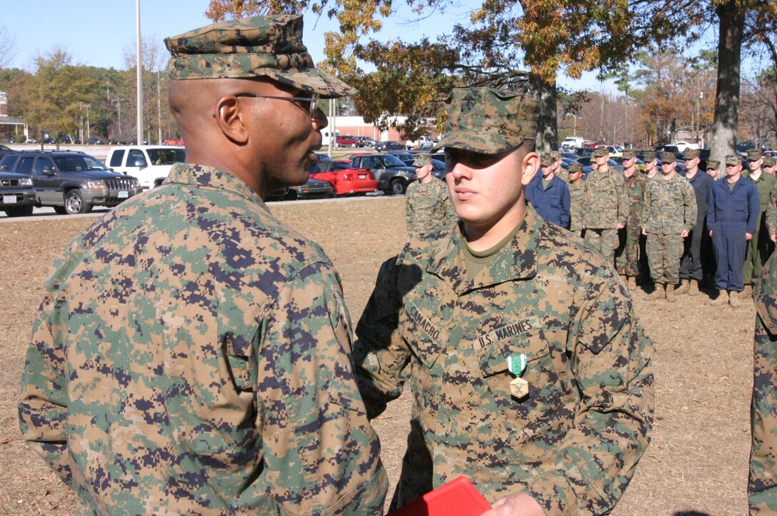 Lance Cpl. Fernando Camacho, a scout with 2nd Light Armored Reconnaissance Battalion (LAR), 2nd Marine Division, was awarded the Navy and Marine Corps Commendation Medal for action taken during Operation Iraqi Freedom in a ceremony here Dec. 12. (Photo by Lance Cpl. Zachary W. Lester)