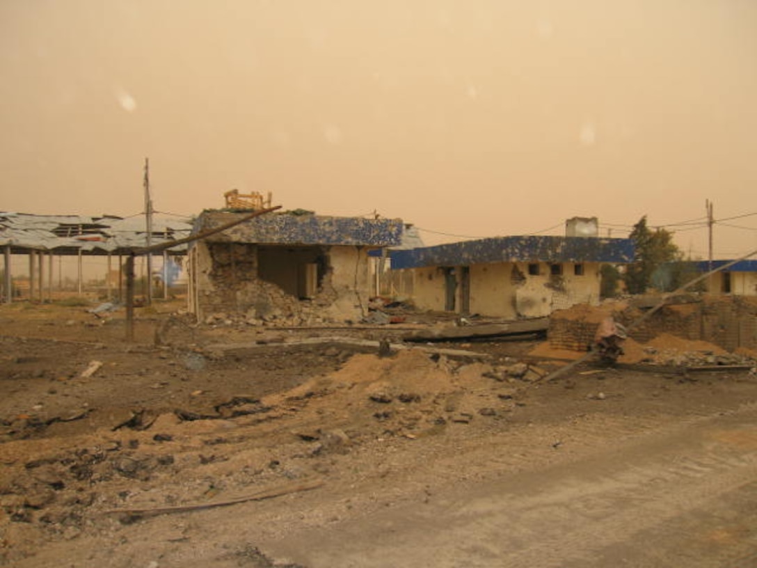 HUSAYBAH, Iraq - Buildings outside of Camp Gannon show scars from the April 11 attack by insurgents. The insurgents attacked the Marines with small arms fire, RPGs and suicide vehicle-borne improvised explosive devices.