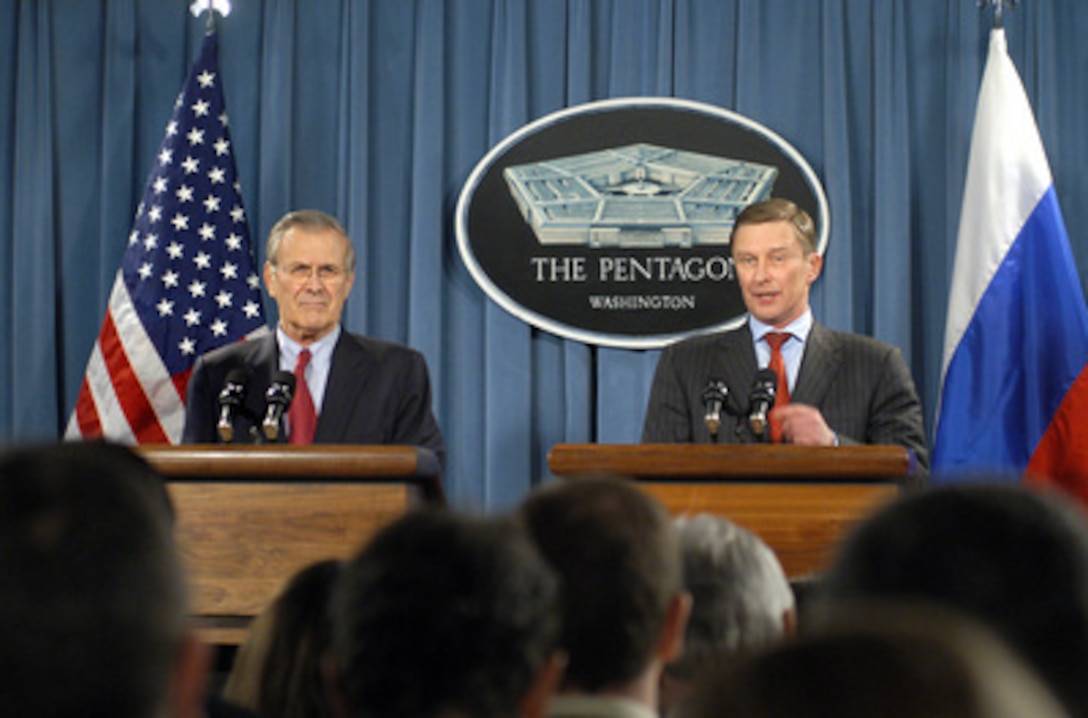 Russian Minister of Defense Sergey Borisovich Ivanov (right) responds to a reporter's question during a joint press conference with Secretary of Defense Donald H. Rumsfeld (left) in the Pentagon on Jan. 11, 2005. Ivanov and Rumsfeld met earlier to discuss a wide range of bilateral security issues. 