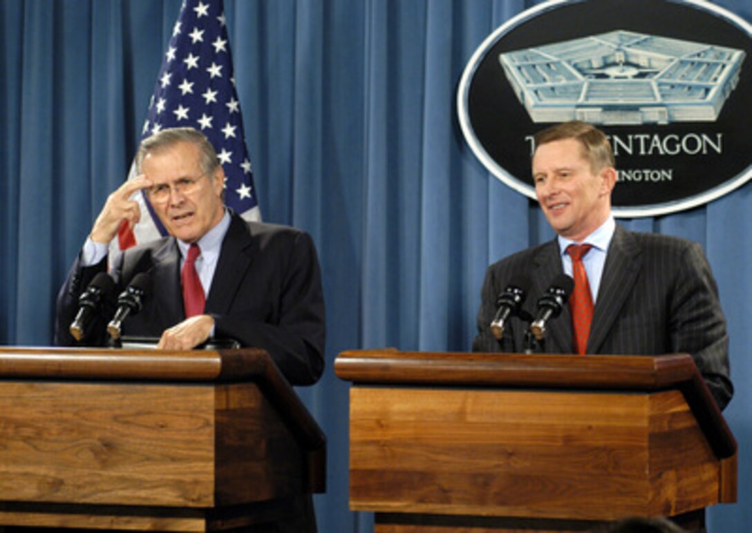 Secretary of Defense Donald H. Rumsfeld (left) responds to a reporter's question during a joint press conference with Russian Minister of Defense Sergey Ivanov (right) in the Pentagon on Jan. 11, 2005. 