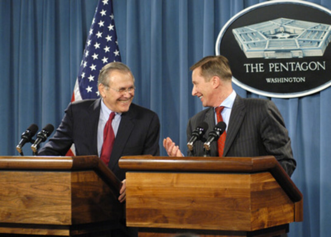 Secretary of Defense Donald H. Rumsfeld (left) shares a light moment with Russian Defense Minister Sergey Borisovich Ivanov (right) during a joint press conference in the Pentagon on Jan. 11, 2005. Rumsfeld and Ivanov fielded questions from the press on issues ranging from the elections in Iraq to export controls on sensitive weapons systems. 