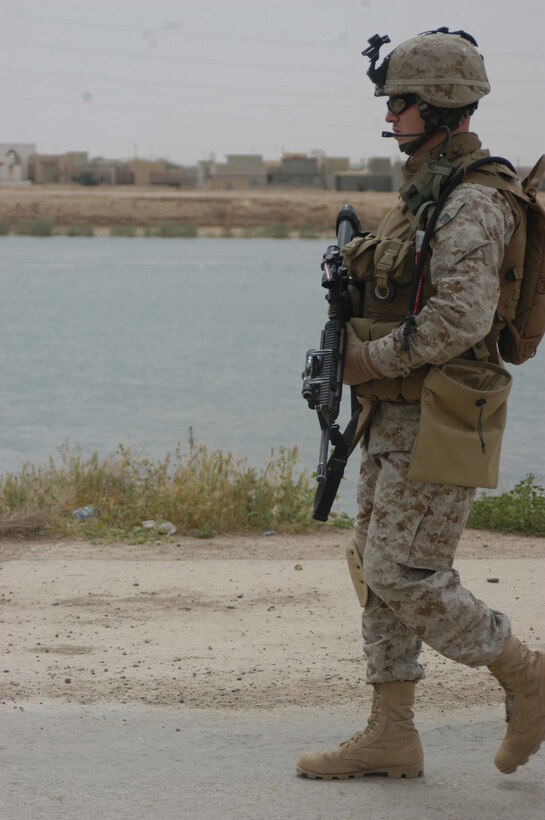 AR RAMADI, Iraq (April 9, 2005) -Sergeant James P. Conway, squad leader, 2nd Squad, 2nd Platoon, Company C, 1st Battalion, 5th Marines, walks along the banks of the Euphrates River during a patrol here. The 25-year-old from Orlando, Fla., led his Marines on a patrol through a neighborhood known as the "Ghetto." Patrols through the neighborhood often include interaction with Iraqi children. Photo by Cpl. Tom Sloan