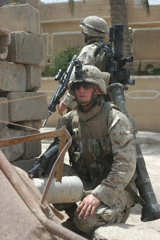 AR RAMADI, Iraq (May 13, 2005) -Posted on a street here, Pfc. Scott P. Williams, a rifleman with 2nd Squad, 2nd Platoon, Company B, 1st Battalion, 5th Marine Regiment, provides security for his fellow Marines during a patrol. The 19-year-old from Des Moines, Iowa, and his fellow 2nd Platoon warriors conducted a three-hour presence patrol through a portion of their company's area of operations notorious for insurgent activity. The Marines encountered sporadic machine gun fire from insurgents during their mission, which was geared toward disrupting enemy activity. The Marines accomplished their mission and returned to their firm base, Camp Ramadi, safely. Photo By: Cpl. Tom Sloan