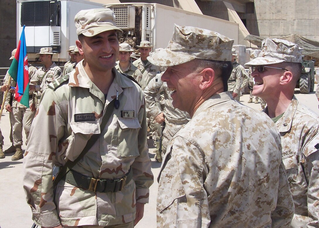 Hadithah Dam, Hadithah, Iraq.-- 1st Lt. Rashad Garayev meets the assistant commandant of the Marine Corps, Gen. William L. Nyland.  Garayev hails from Baku, the capital of Azerbaijan.  He is serving a twelve month tour in Iraq as a logistics officer.  Garayev is responsible for arranging maintenance for the Azerbaijani's vehicles and weapon systems, as well as dealing with supply issues and troop movement.  (Photo by Azerbaijan Army Pvt. Jamalov )