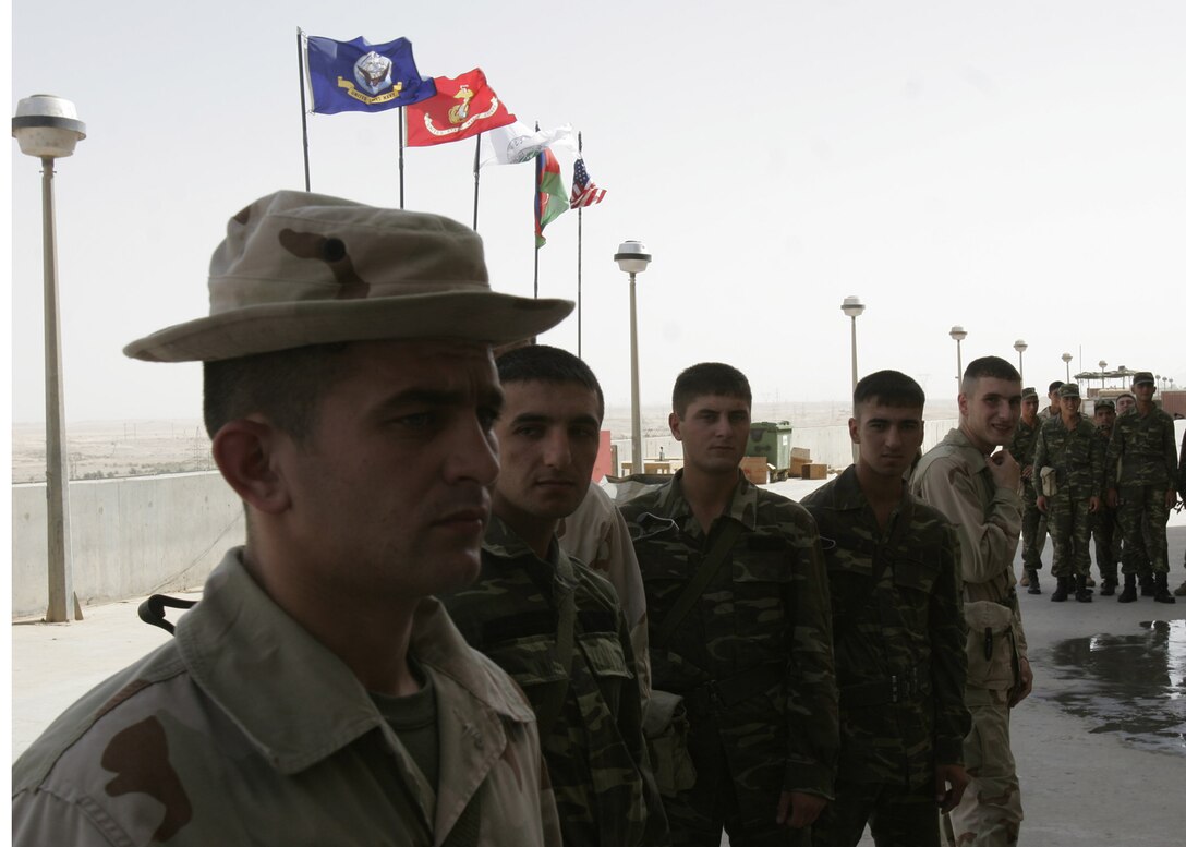 Hadithah Dam, Hadithah, Iraq.-- A line of Azerbaijanis form for chow outside the dam.  The new soldiers on deck will serve a six month tour at Hadithah Dam before returning to their home country in January.  The soldiers completed six months of training in Azerbaijan prior to deploying to Iraq.  (Photo by Lance Cpl. Marc Fencil)