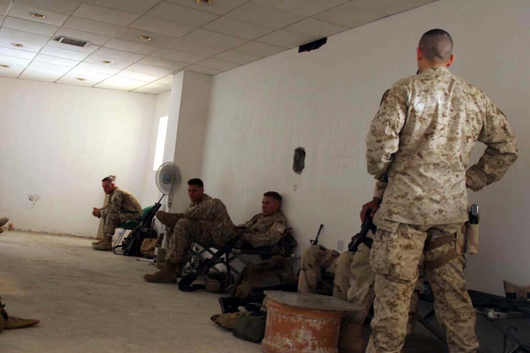 Baghdad, Iraq -- Marines from 3rd Battalion, 8th Marine Regiment wait in the basement of the court building until it is their time to testify in front of a judge.  The Marines are in their final stage of putting the detainees away into jail.  Official U.S. Marine Corps photo by Cpl. Athanasios L. Genos