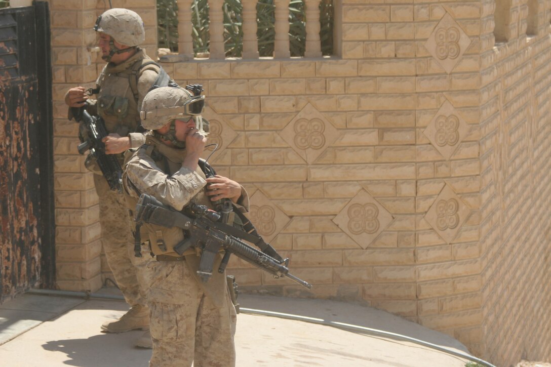 BANI DAHRI, Iraq ? Marines of 1st Squad, 3rd Platoon, K Company, 3rd Battalion, 2nd Marine Regiment, Regimental Combat Team 2, patrol through the city here during Operation Quick Strike.