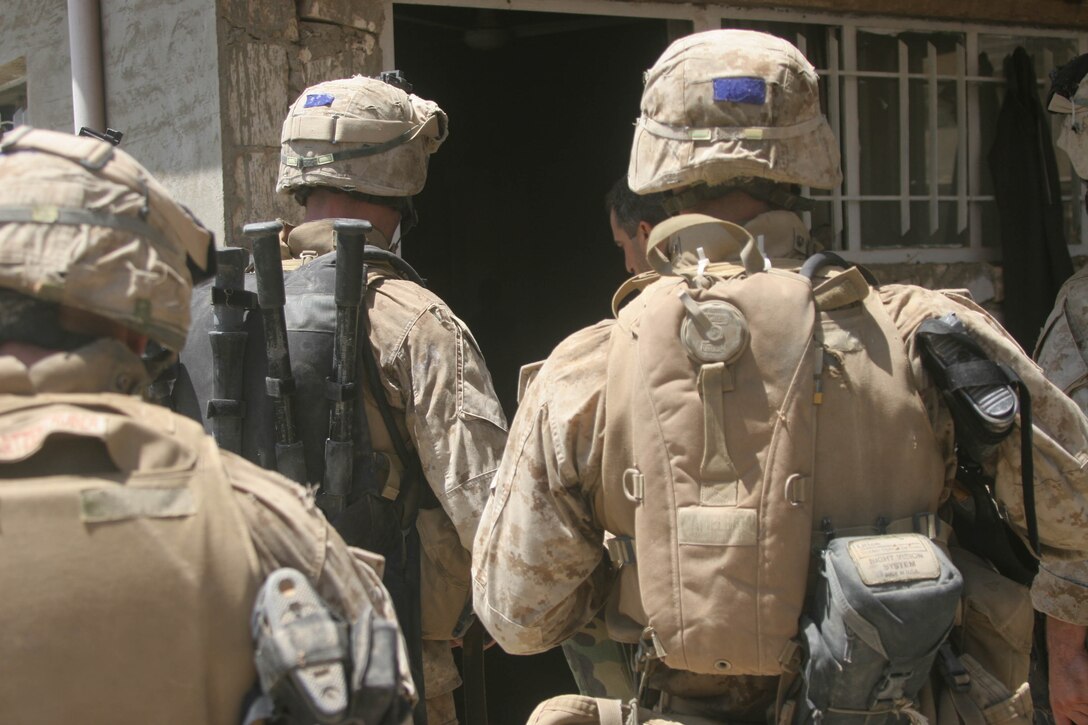 BANI DAHRI, Iraq - 1st Squad, 3rd Platoon, Company K, 3rd Battalion, 2nd Marine Regiment, Regimental Combat Team-2 patrol through the city here during Operation Quick Strike.