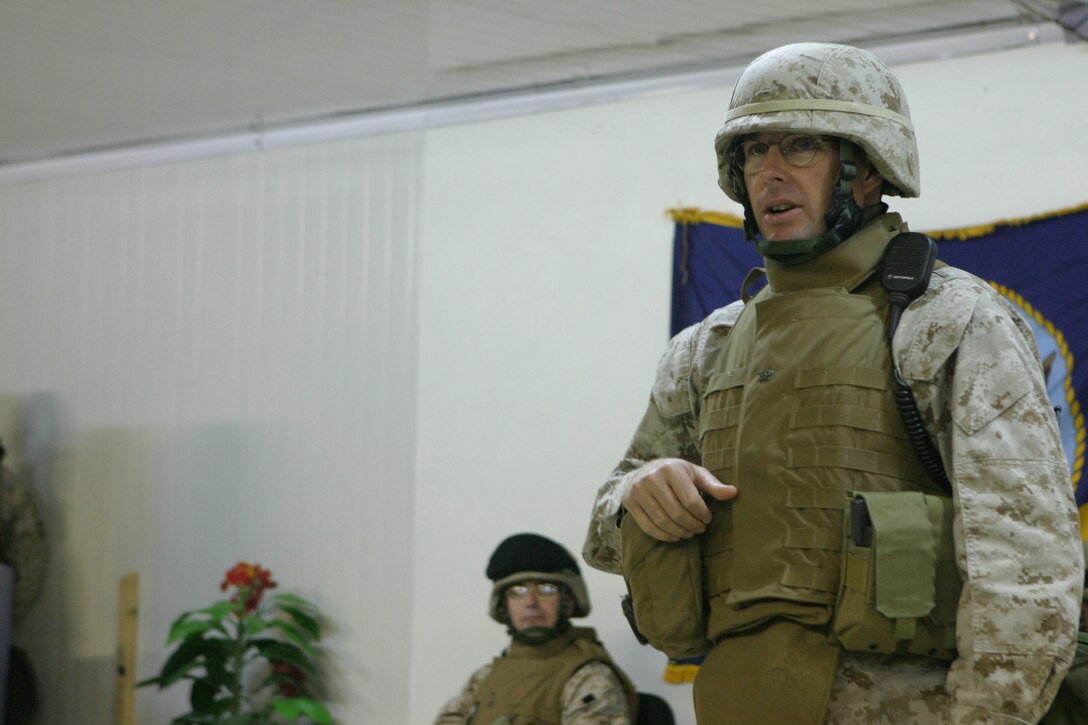 CAMP BLUE DIAMOND, AR RAMADI, Iraq - Colonel David K. Hough, the commanding Officer of Headquarters Battalion, 2nd Marine Division, speaks to Sailors, Soldiers and Marines Oct. 13 during a ceremony for the 230th birthday of the Navy. Service members with the 2nd Marine Division celebrated the Navy's birthday with a traditional cake cutting ceremony.