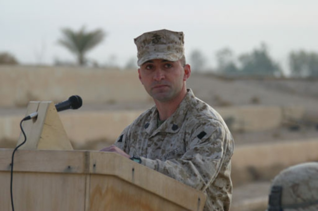 Staff Sgt. Jason A. Cobb speaks during a memorial service for one of his Marines, Cpl. William G. Taylor, a 26-year-old Kansas City, Mo. native, who was killed in action Nov. 30, 2005 by anti-coalition forces while deployed with Weapons Company, 2nd Battalion, 6th Marines.