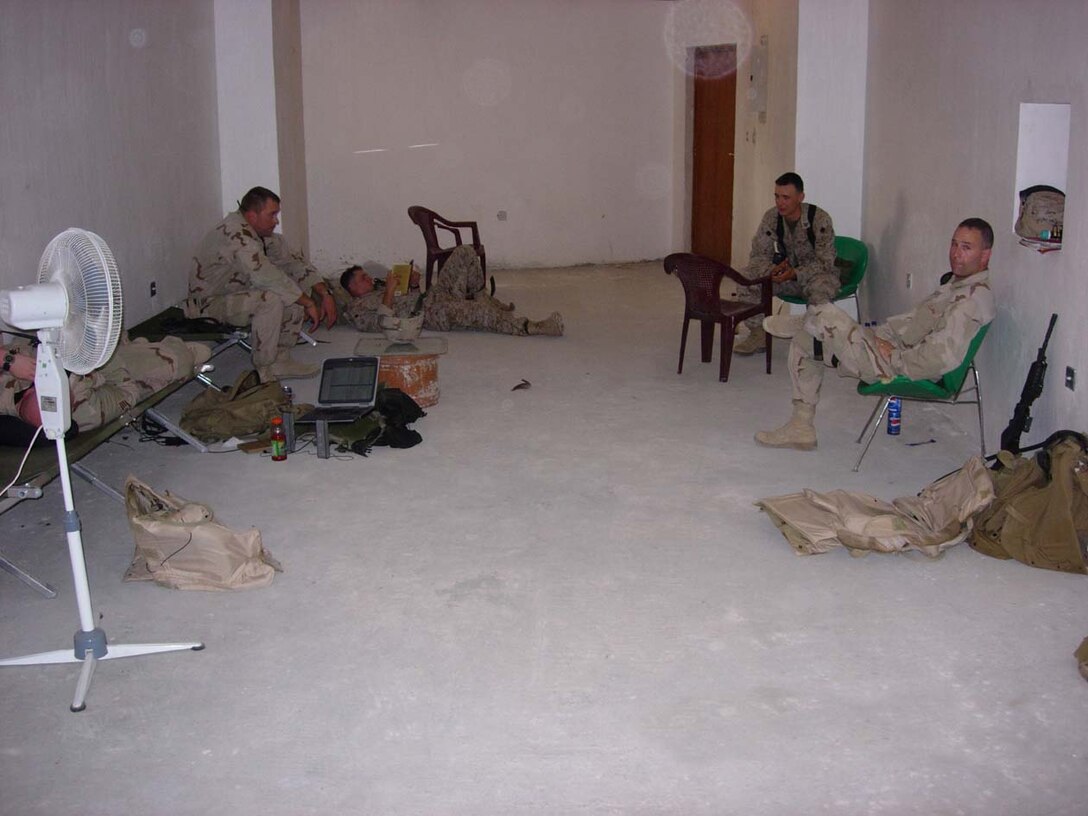 Baghdad, Iraq -- Marines from 3rd Battalion, 8th Marine Regiment and other service members wait in the basement of the court building until it is their time to testify in front of a judge.  The Marines are in their final stage of putting the detainees away into jail.  Official U.S. Marine Corps photo by Cpl. Athanasios L. Genos