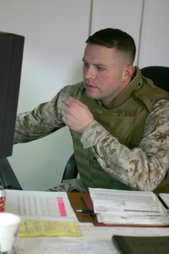 Corporal John R. Glynn calls the shots on more than four million dollars.  He isn't an executive at some major company with a six digit salary but the 28 year-old from Atlanta, Ga. still loves what he does.  The money he controls buys gear for Marines deploying to Iraq.  Official U.S. Marine Corps photo by Cpl. Shawn C. Rhodes
