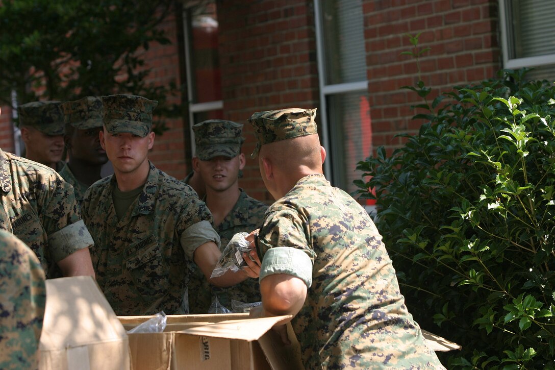 MARINE CORPS BASE CAMP LEJEUNE, N.C. (June 13, 2005) – Marines with 2nd Battalion, 2nd Marine Regiment, 2nd Marine Division received Under Armour t-shirts and socks here June 14, from Operation Troop Appreciation, a non-profit organization founded by Kristen Holloway.