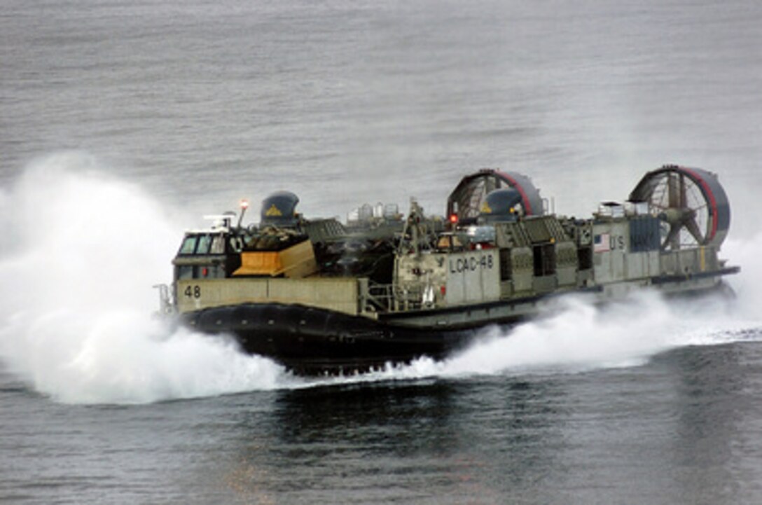 A U.S. Navy Landing Craft Air Cushioned from the USS Bonhomme Richard (LHD 6) heads to the beach of Meuloboh, Sumatra, Indonesia, on Jan. 11, 2005, to deliver humanitarian relief supplies. Landing craft and helicopters from the Richard and Expeditionary Strike Group 5 are participating in Operation Unified Assistance, a multinational relief effort to bring food, water, and medical care to victims of the Dec. 26 Indian Ocean tsunami. 