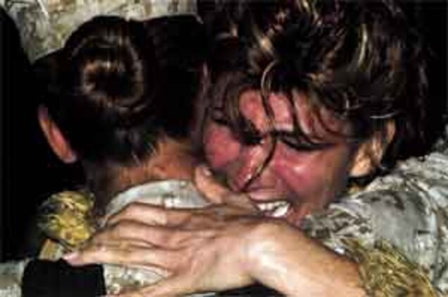 Sgt. Baleny Mines is greeted by her mother Rebecca during HMLA-775?s homecoming Sunday. Nearly 280 Marines arrived home after a seven-month deployment in Iraq.