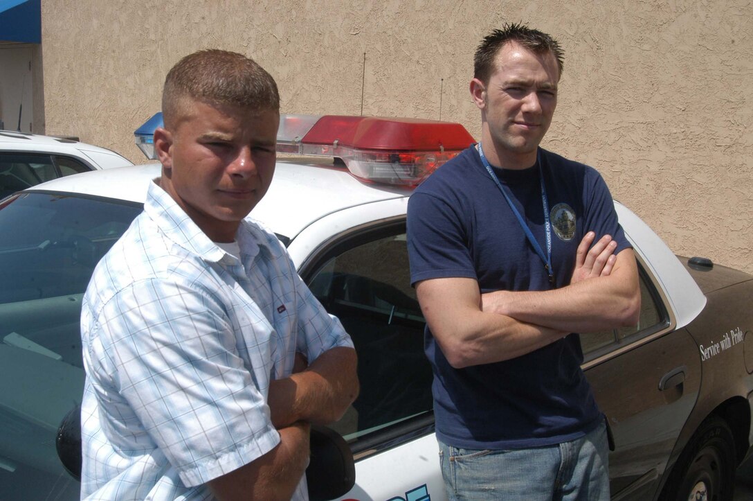 Camp Pendleton based Marine David A. Zeak reunites with Police Officer Matthew Parenteau of the Oceanside Police Department Monday.