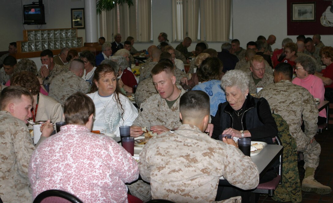 050314-M-2607O-002 MARINE CORPS BASE CAMP LEJEUNE, N.C. (March 14, 2005) – Members of the Ladies Auxiliary for the Veterans of Foreign Wars share lunch at dining facility 512 with the Marines of 2nd Battalion, 10th Marine Regiment, during JoAnne Ott’s, the national president, three week tip to visit posts in the 50 states.  Ott thanked the Marines for their hospitality and the job they do every day.