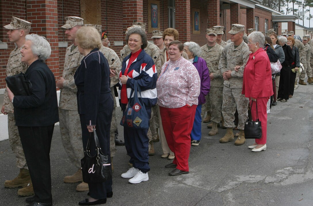 050314-M-2607O-003 MARINE CORPS BASE CAMP LEJEUNE, N.C. (March 14, 2005) – Members of the Ladies Auxiliary for the Veterans of Foreign Wars wait in line with the Marines of 2nd Battalion, 10th Marine Regiment, at dining facility 512 to have lunch and share stories as part of JoAnne Ott’s, the national president, tour of the 50 states.  The ladies and the Marines enjoyed themselves during the visit.