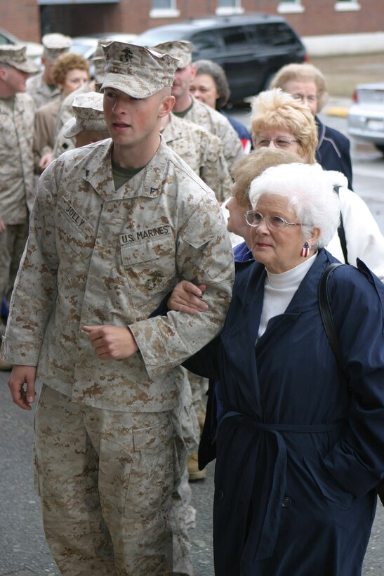 050314-M-2607O-004 MARINE CORPS BASE CAMP LEJEUNE, N.C. (March 14, 2005) – A Marine from 2nd Battalion 10th Marine Regiment escorts a member of the Ladies Auxiliary for the Veterans of Foreign Wars during their visit to Camp Lejeune on March 14.  Their national president, JoAnne Ott, visited the local auxiliary post for the first time as part of her tour of all 50 states during her one year term.