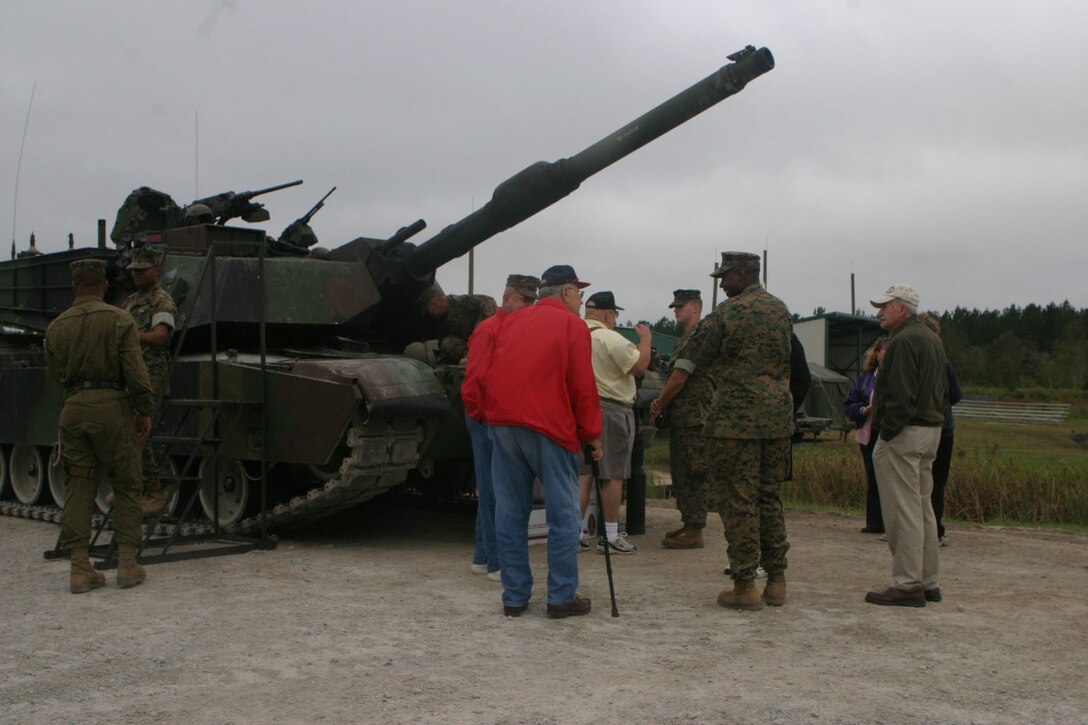 MARINE CORPS BASE CAMP LEJEUNE, N.C.(Oct. 14, 2005)- A Marine with 2nd Tank Battalion and a former Marine with the Marine Corps Tank Association talk about times they had while they were deployed after the Tankers of the Year Award ceremony at the SR-10 range here. (Official U.S. Marine Corps photo by Lance Cpl. Lucian Friel (RELEASED)