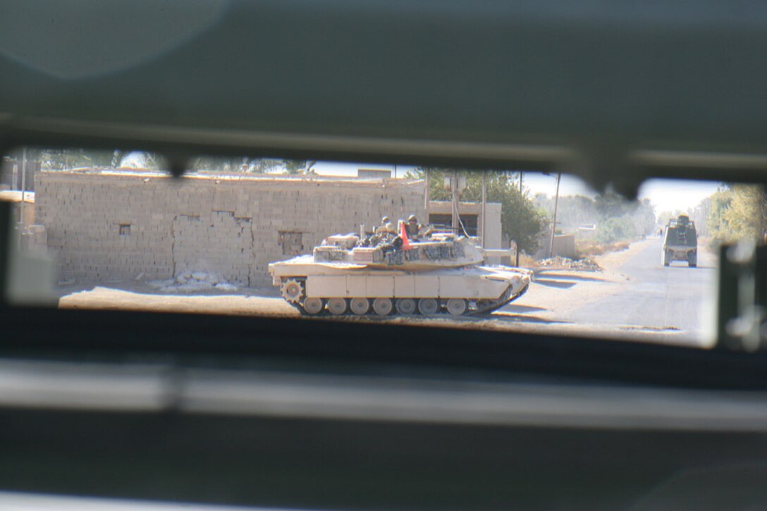 051114-M-2607O-001 - Marines from 2nd Tank Battalion block the main roads out of the area during the first day of Operation TRIFECTA to make sure that no one leaves the area.