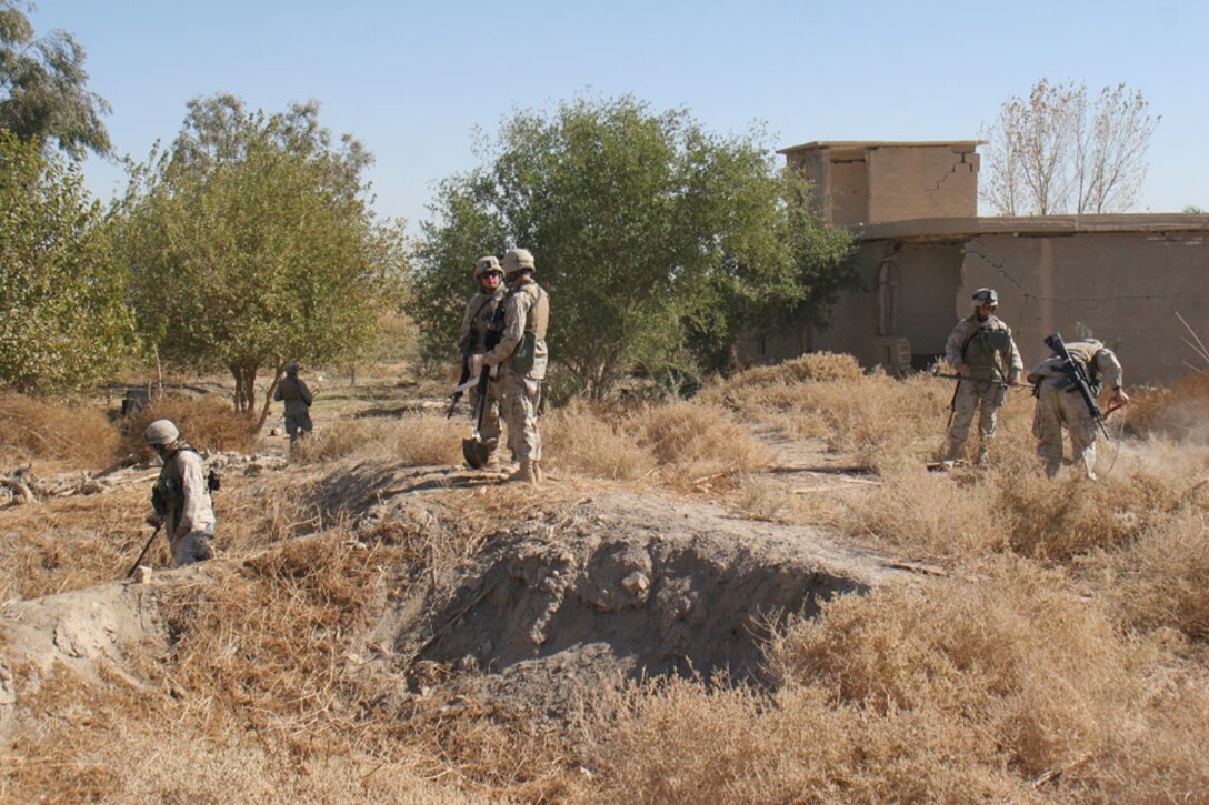 051114-M-2607O-003 - Combat engineers attached to Company F, 2nd Battalion, 2nd Marine Regiment, search a village on the first day of Operation TRIFECTA looking for weapons caches.