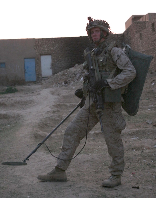 HAQLANIYAH, Iraq (Nov. 26, 2005)  - Oconomowoc, Wis. native, Lance Cpl. Darin J. Wittnebel, takes the PSS-12 metal detector with him on every patrol he is on here. Recently Wittnebel, a rifleman with India Company, 3rd Battalion, 1st Marine Regiment, used his metal detector to find an improvised explosive device outside of his firm base that could have been deadly to Marines or other people in the village. (Official Marine Corps photo by Cpl. Adam C. Schnell)