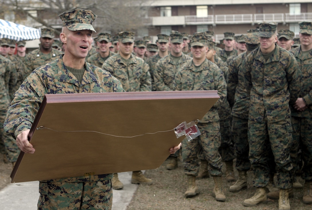 MARINE CORPS BASE CAMP LEJEUNE, N.C. - Sergeant Major T.F. Hall addresses the Marines of 1st Battalion, 6th Marine Regiment here Dec. 14 shortly after receiving a farewell present and being relieved of his position.  Hall, a veteran of Operations Enduring Freedom and Iraqi Freedom, was relieved by 1st Sgt. Ernest Hoopii.  Hall is currently 2nd Assault Amphibian Battalion's sergeant major.