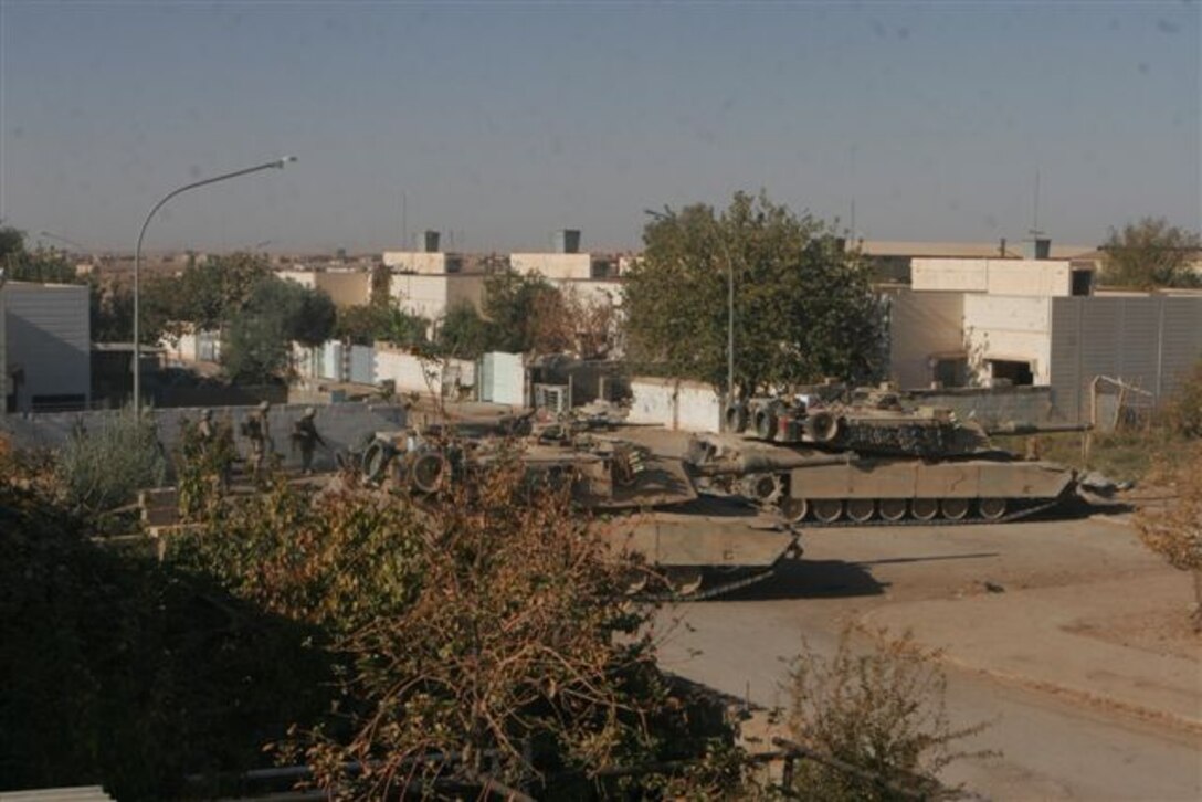UBAYDI, Iraq ? Two Marine M1 Abrams tanks keep watch for insurgents Nov. 14. The Marines assigned to 3rd Platoon, Company E, 2nd Battalion, 1st Marine Regiment, participated in Operation Steel Curtain against insurgents here and within other border towns on the Lower Euphrates River Valley recently.
