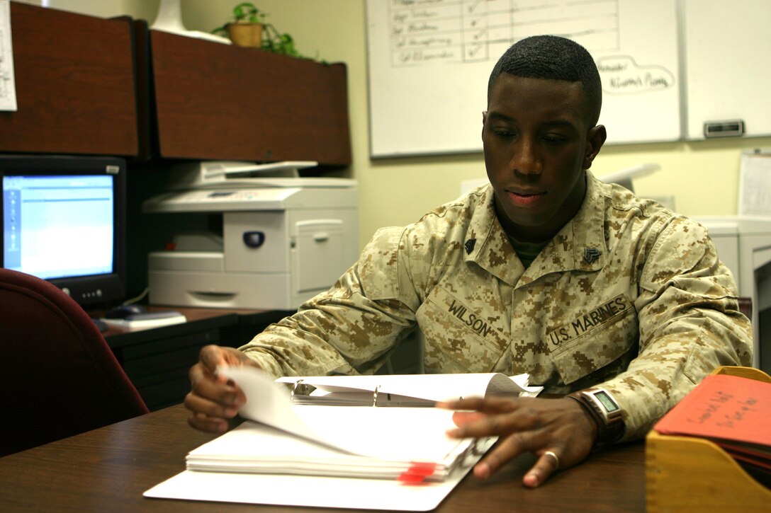 MARINE CORPS BASE CAMP LEJEUNE, N.C. (February 14, 2005) - Sergeant Acquil S. Wilson, the supply operations noncommissioned officer in charge for 2d Marine Division double checks a supply rosters while assisting with the daily supply operation within the Division.