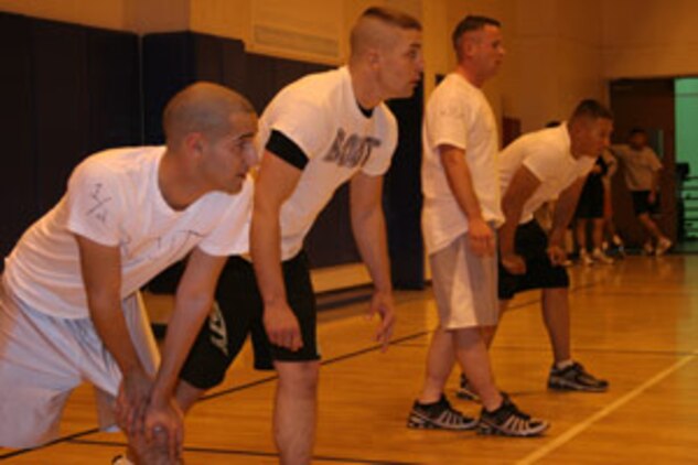 The four ?boots? of the Four Boots and an NCO team stand poised outside the starting line for the whistle to blow during the opening night of the MCAGCC Dodgeball Tournement Nov. 14 at the East Gym.