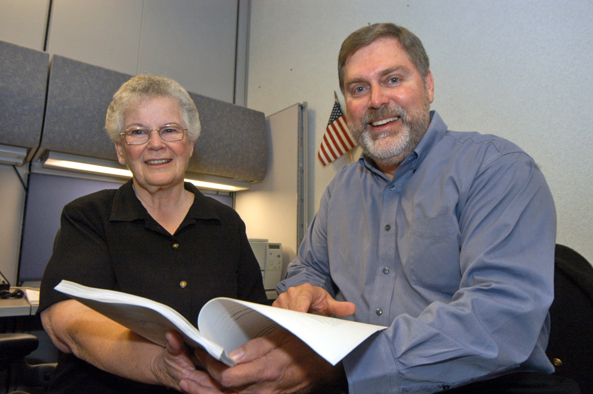 ROBINS AIR FORCE BASE, Ga. -- Don Jenrette reunites with June Bradley after 30 years to give his former educational counselor a copy of his doctoral dissertation.  (U.S. Air Force photo by Sue Sapp)