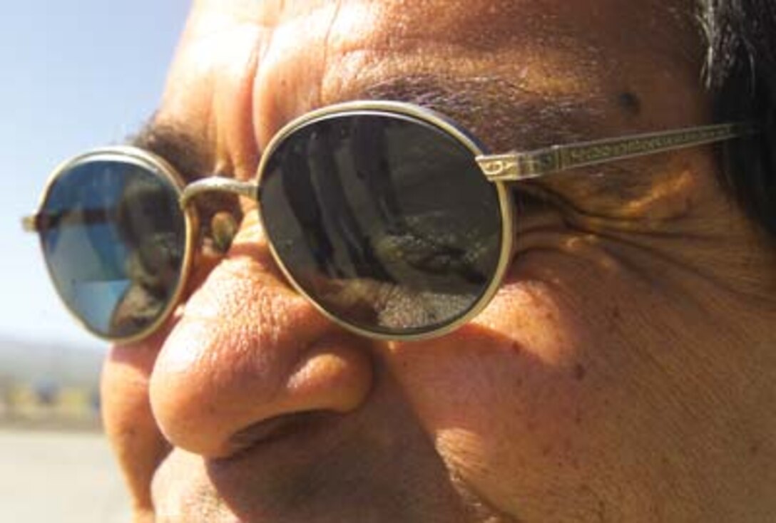 Gilbert "Gibby" Sena, the lead employee for Cost Work Center 725 at MCB Barstow looks on from his safety glasses, which the Marine Corps paid for through a grant. He chose them because they resembled the "Beatles style," which he likes.