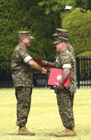 Marines welcome aboard Sgt.Maj. Randolph L. Mitchell during a Post and Relief Ceremony at Marine Corps Air Station Iwakuni, June 17.