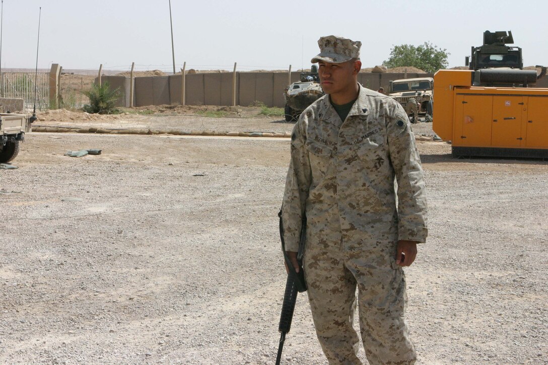Cpl. Freddy Medina, Civil Affairs Assistant/Gunner, 5th Civil Affairs Group, Regimental Combat Team 2, arrives in Al-Asad to help with a memorial video.  The Annandale, Va., native and 5th CAG work to rebuild the country of Iraq.  (Photo by LCpl. Zachary W. Lester