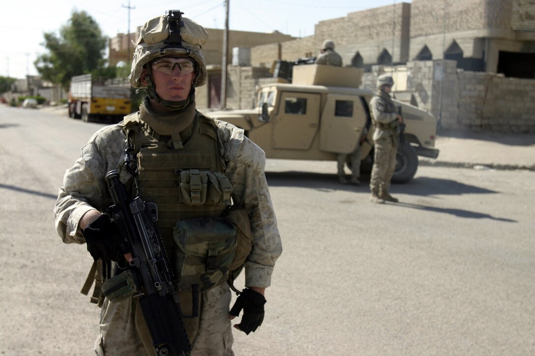 FALLUJAH, Iraq - Lance Cpl. Chris Graves, a squad automatic weapon gunner with 4th Platoon, Company C, 1st Battalion, 6th Marine Regiment, prepares to step off on patrol here Sept. 15.  Since mid-March, the 20-year-old Wakeman, Ohio native has been assisting his fellow Marines and Iraqi Security Forces conduct counterinsurgency operations throughout Northern Fallujah.